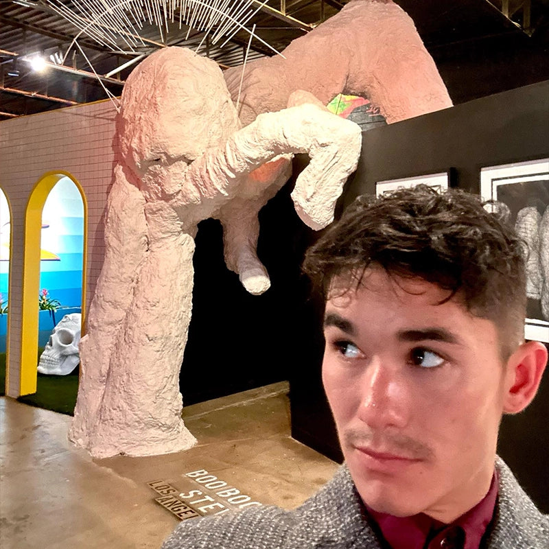Selfie in front of a large pale-pink elephant installation at Gallery DeFi.