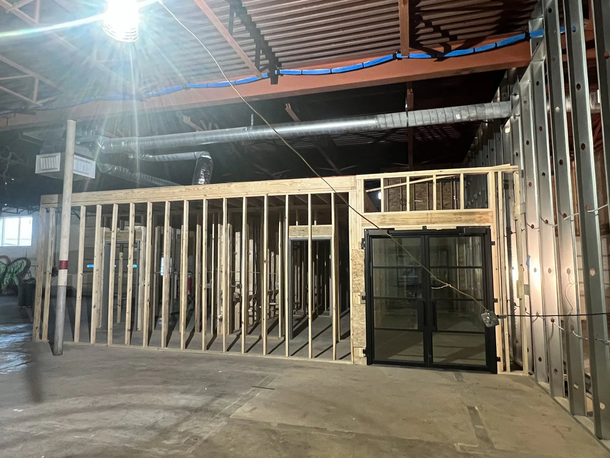 Timber partition walls under construction inside Gallery DeFi